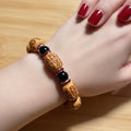 Light Enshrined Wood & Black Glass Bead Bracelet